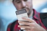 An attendee holds a Google Inc. Pixel 2 XL smartphone during a product launch event in San Francisco, California, U.S., on Wednesday, Oct. 4, 2017. Google unveiled the second generation of its own devices along with an array of entirely new gadgets, plowing the company deeper into a competitive consumer hardware market.
