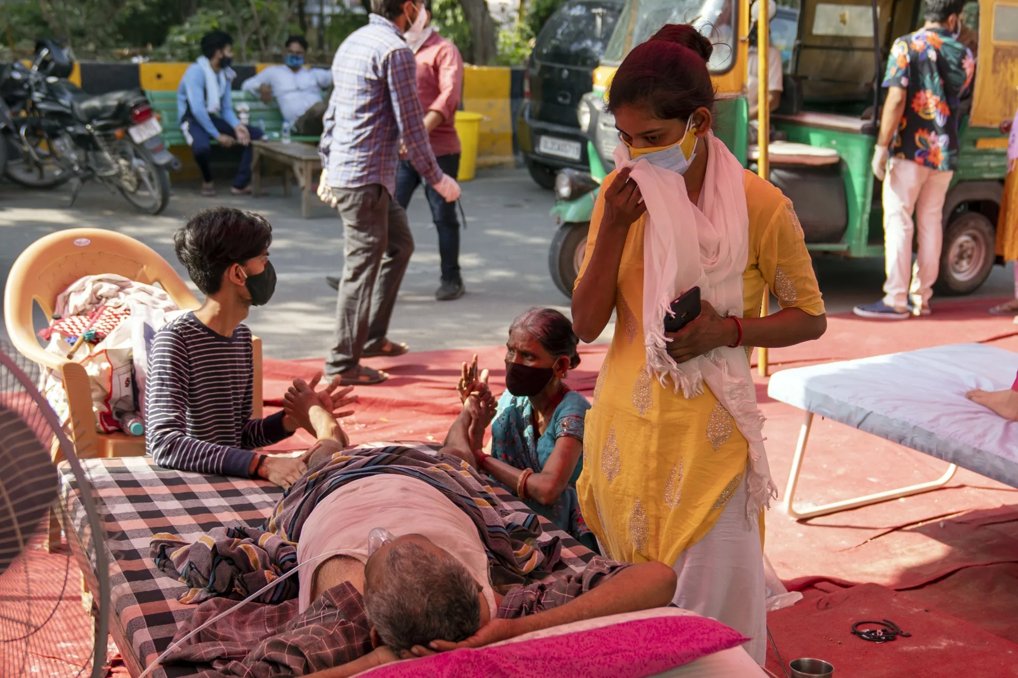 Relatives attend to a Covid-19 patient receiving oxygen in Uttar Pradesh, India, on May 11.