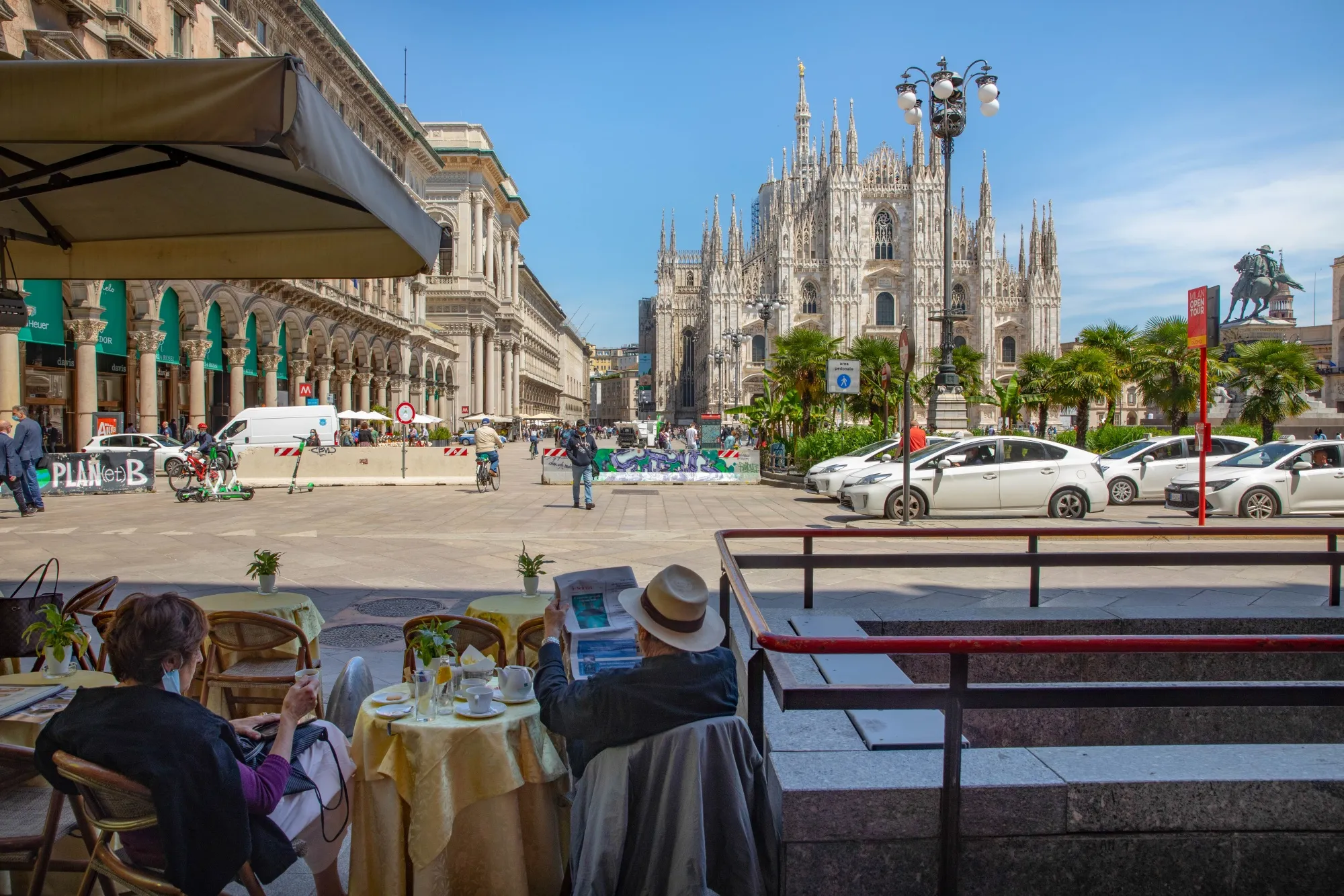 Customers sit at a terrace overlooking Duomo Cathedral in Milan, May 27.