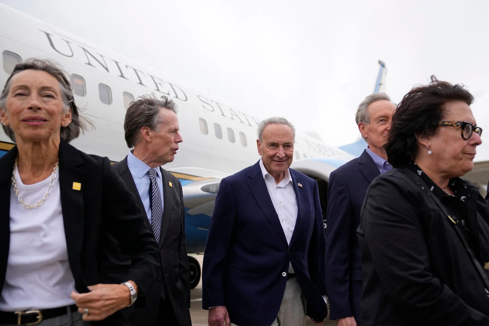 Chuck Schumer, Mike Crapo and other members of the delegation arrive at Shanghai airport.