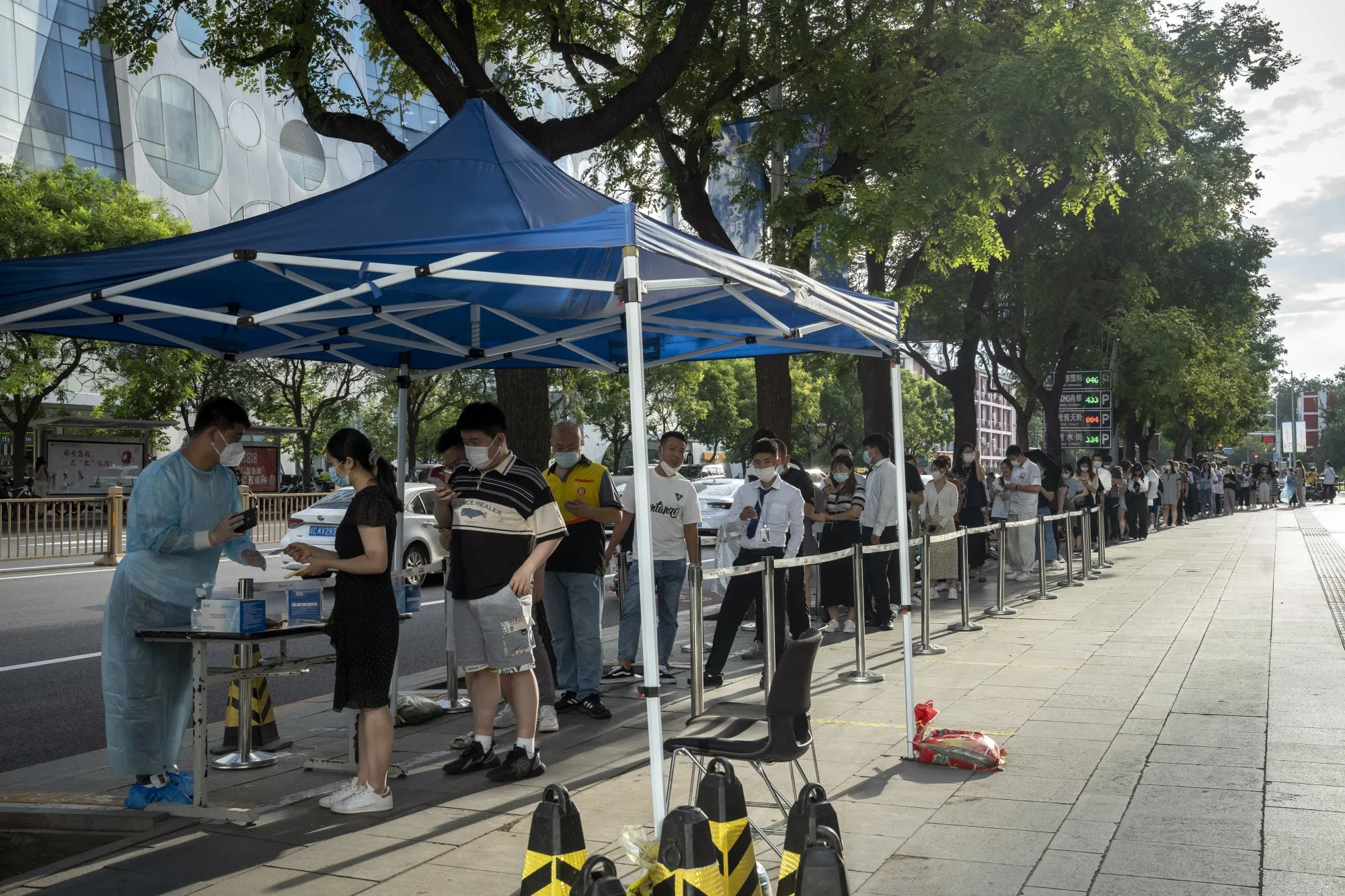 Residents queue at a Covid-19 testing station in Beijing.