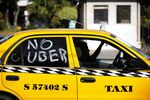 Why can't we be friends? A San Salvador taxi driver takes part in a demonstration against Uber. 