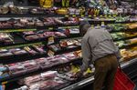 A customer shops in the meat aisle of a store in San Francisco.