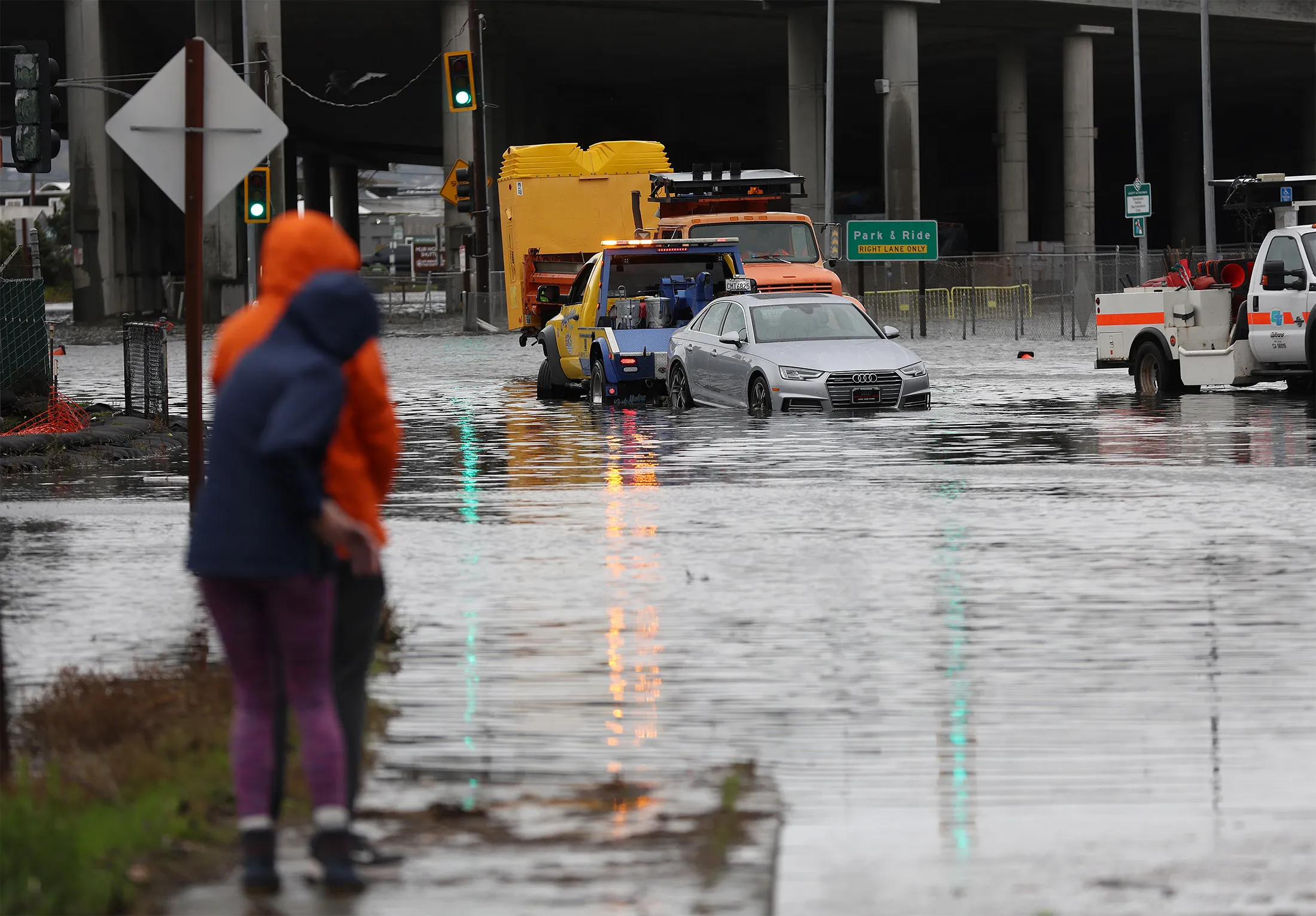 A tow truck pulls a car out of a flooded intersection&nbsp;in Mill Valley, Calif., on Jan. 4.