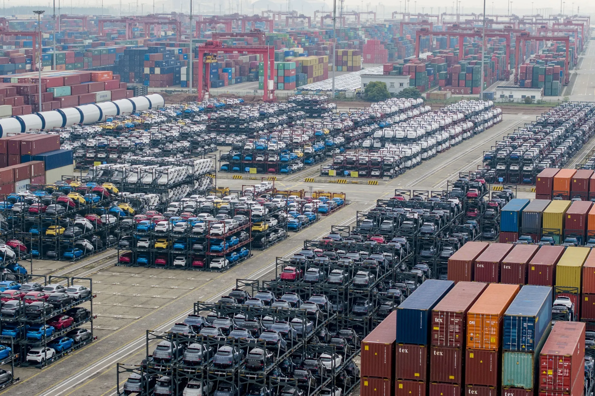 Electric cars for export stacked at the international container terminal of Taicang Port in Suzhou, China.