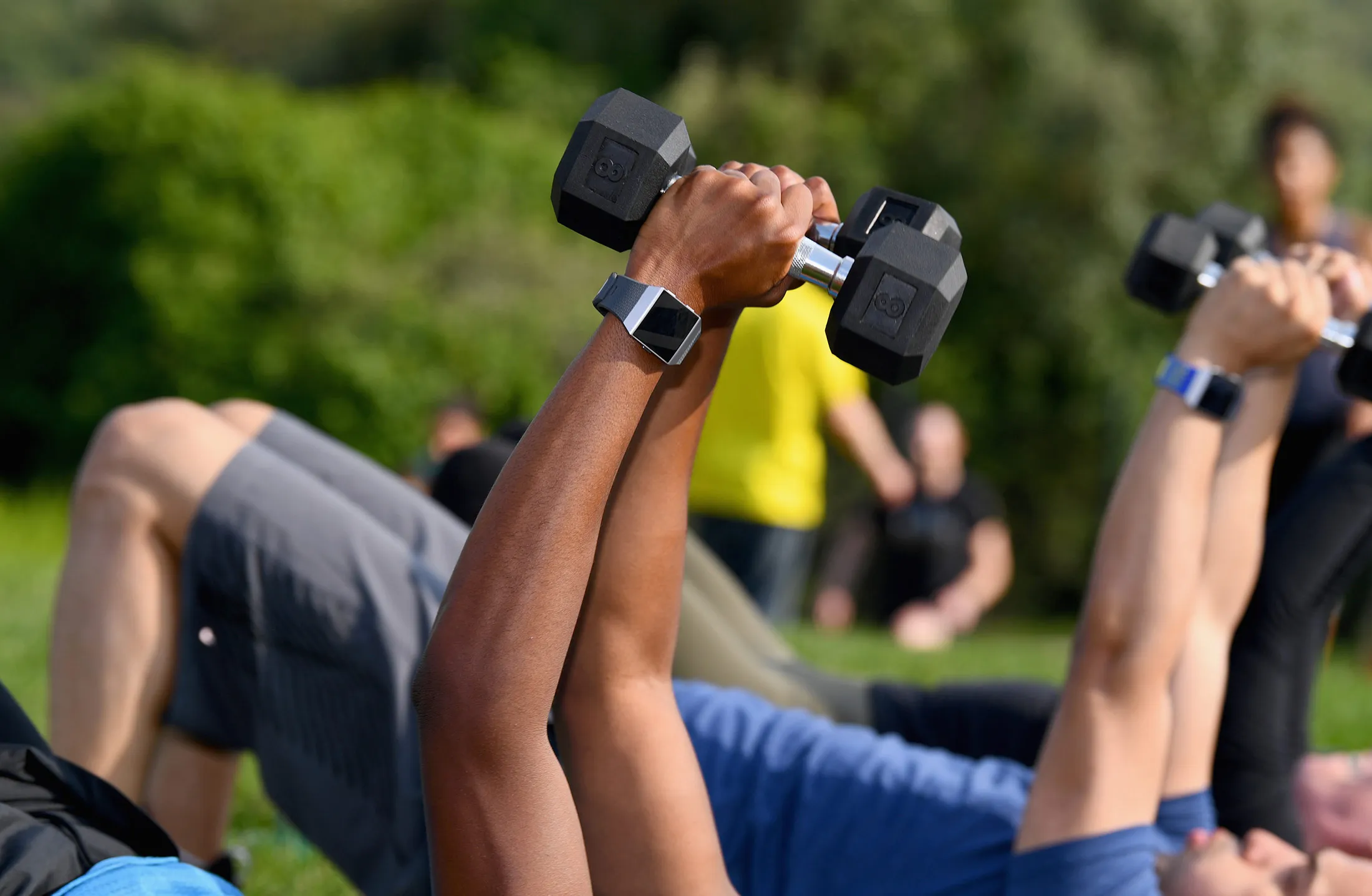 People work out while&nbsp;using Fitbit&nbsp;devices.&nbsp;