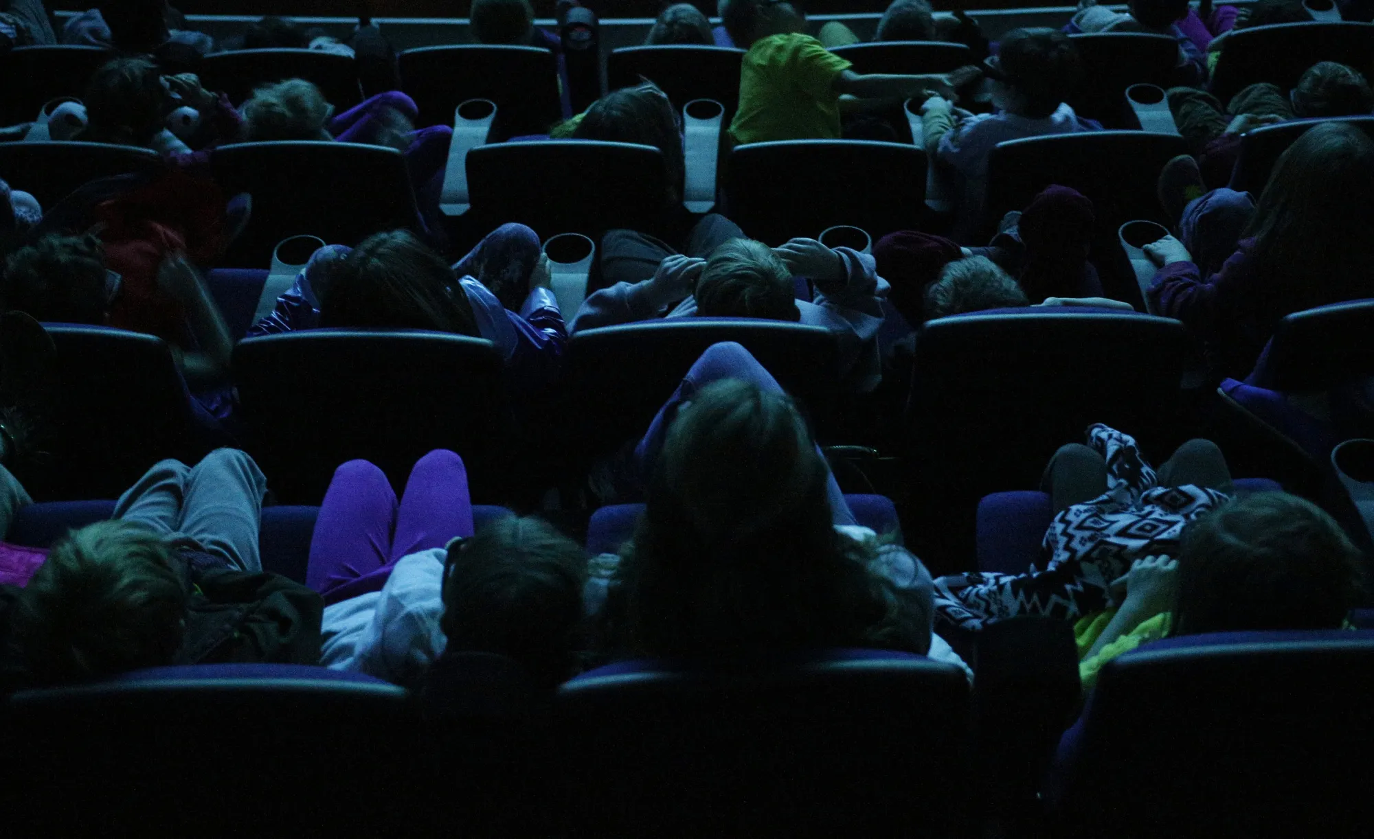 Audience members wear 3D glasses while watching a movie at a theater in Chattanooga, Tennessee.