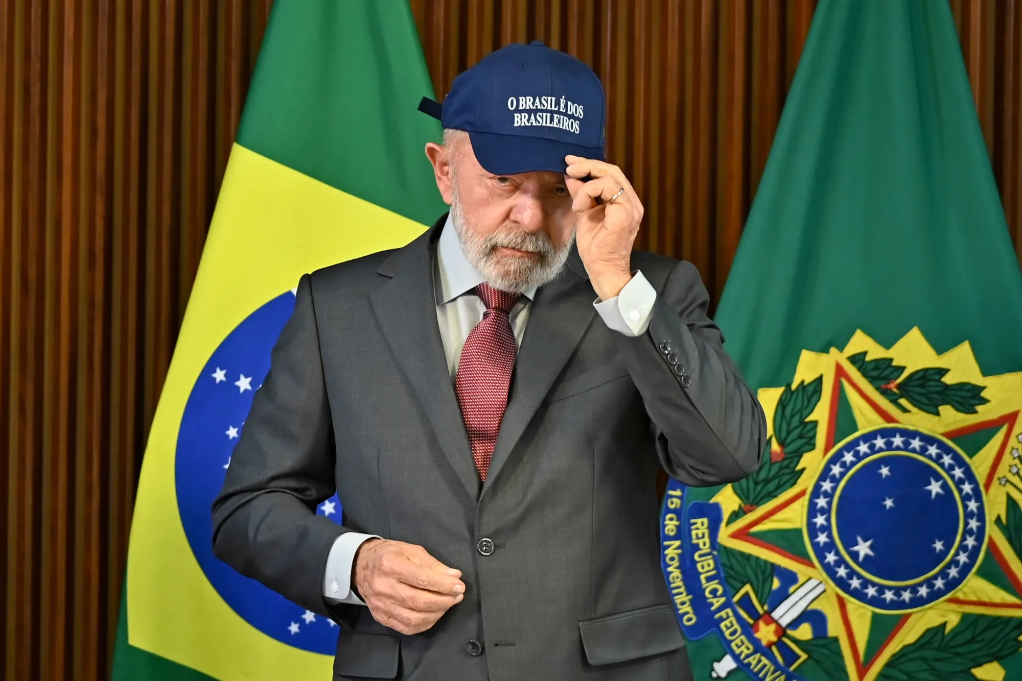 Luiz Inacio Lula da Silva wiht a hat saying “Brazil belongs to Brazilians”
