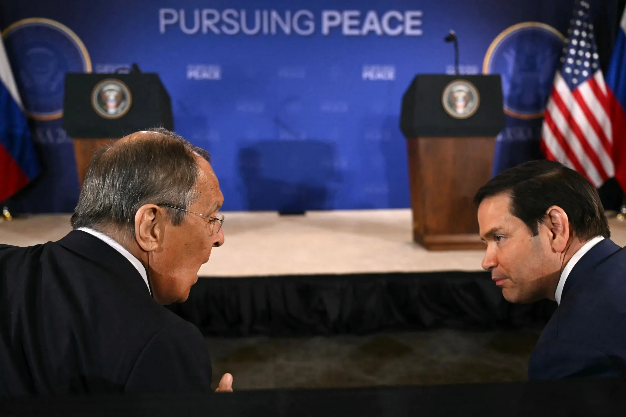 Russian Foreign Minister Sergei Lavrov, left, and US Secretary of State Marco Rubio chat at a US-Russia summit on Ukraine at Joint Base Elmendorf-Richardson in Anchorage, Alaska, on Aug. 15, 2025.