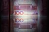 Chinese one-hundred yuan banknotes are arranged for a photograph in Seoul, South Korea.