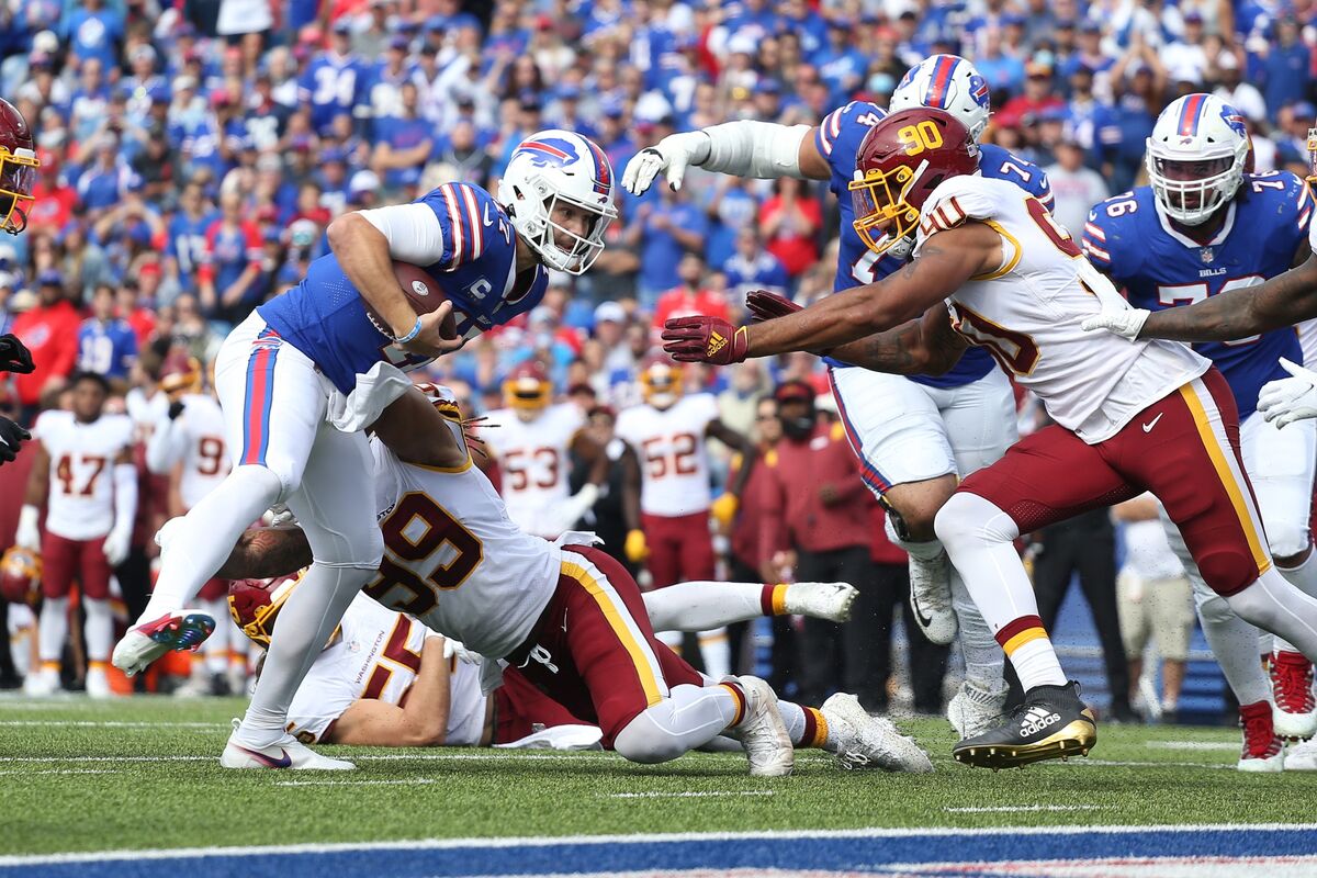 Buffalo Bills quarterback Josh Allen (17) runs onto the field prior to the  second half of an NFL football game against the Houston Texans in Orchard  park, N.Y., Sunday Oct. 3, 2021. (