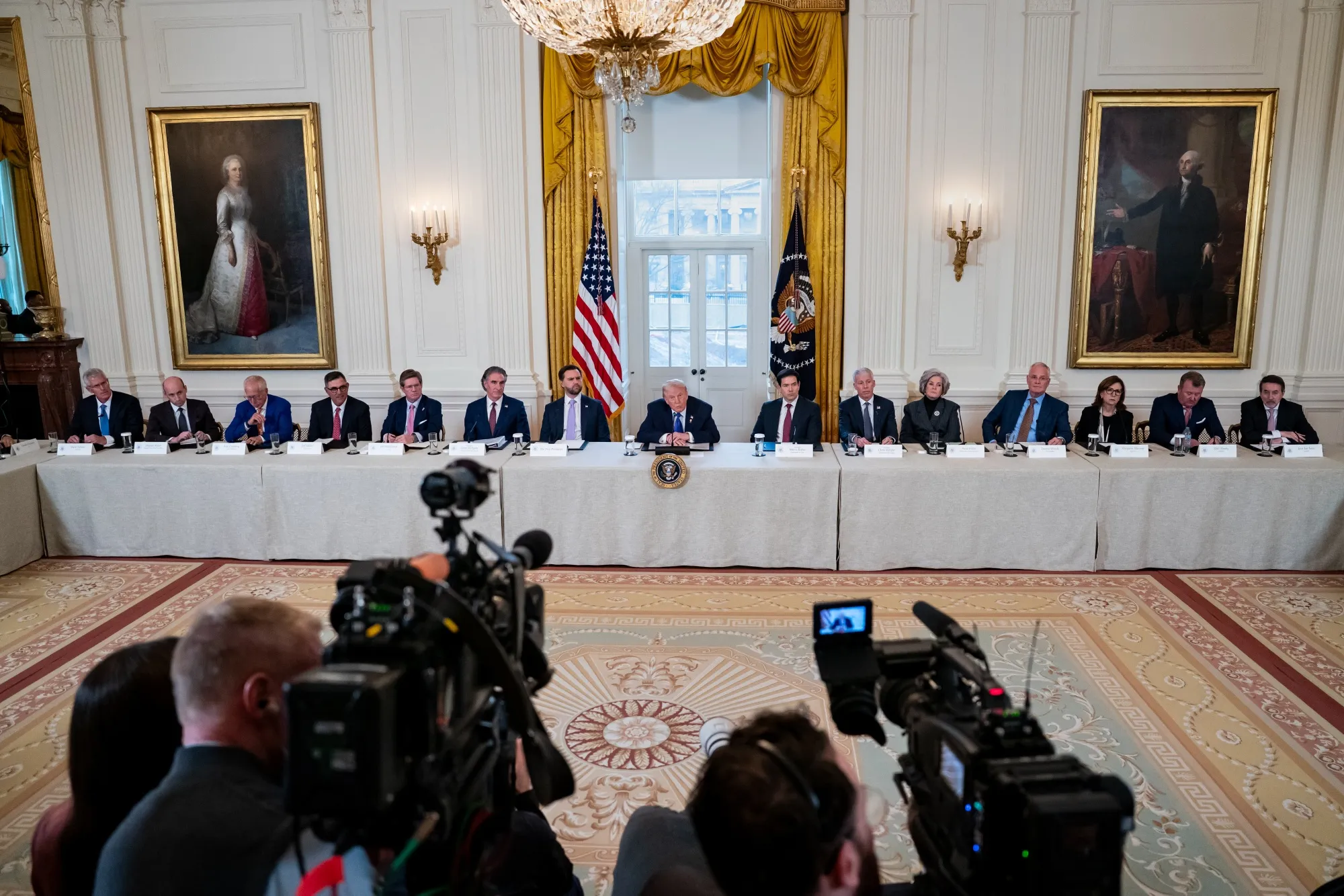 Trump, center, speaks during a meeting with oil executives in the East Room of the White House in Washington on Friday.