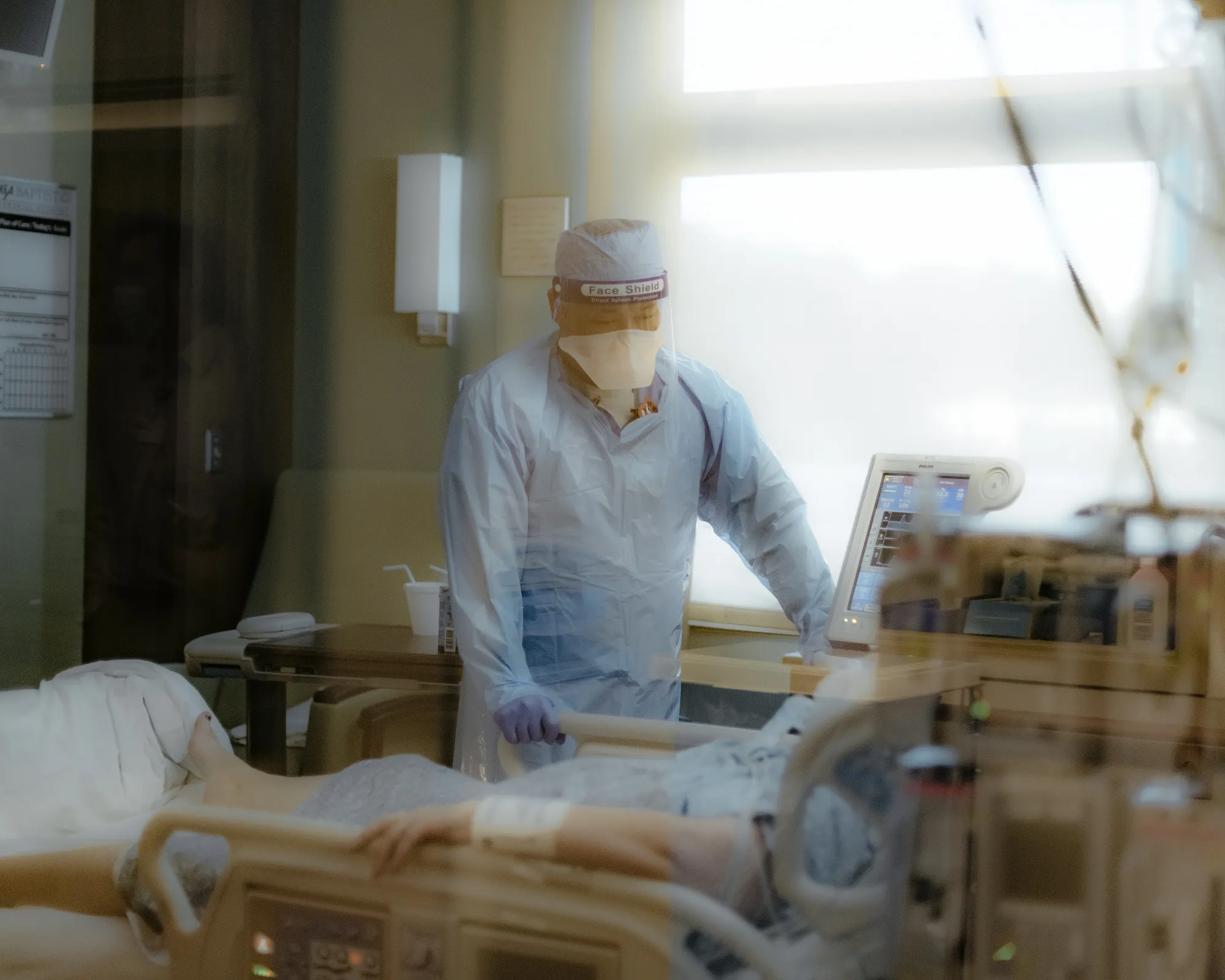 A nurse checks on a patient in the ICU Covid-19 ward.