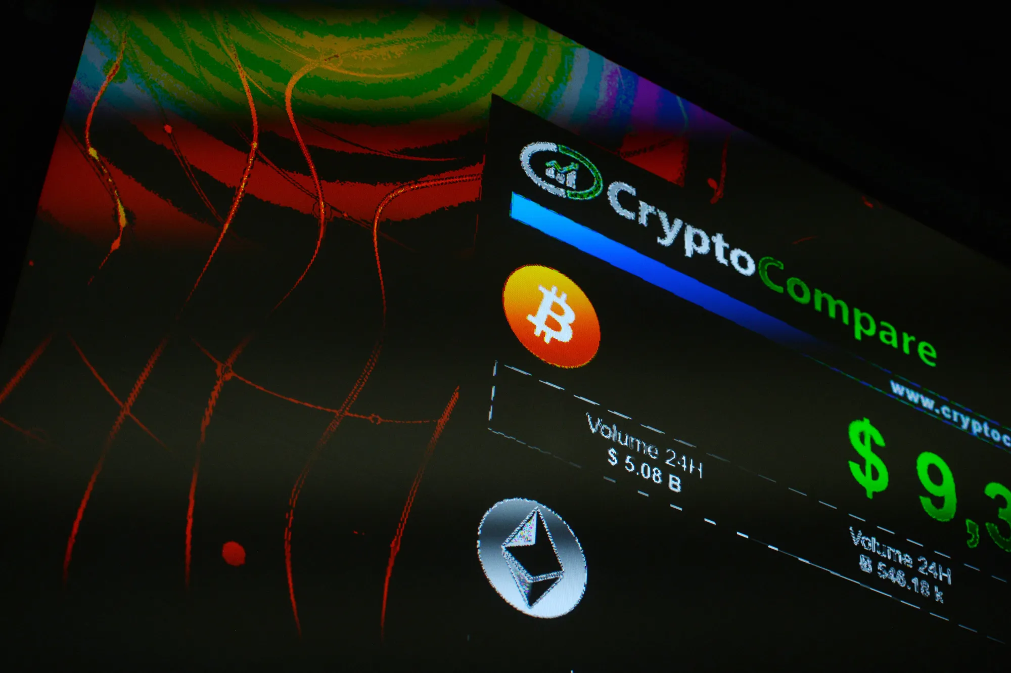The symbols of Bitcoin and Ethereum cryptocurrencies sit displayed on a screen during the Crypto Investor Show in London, U.K., on Saturday, March 10, 2018.&nbsp;