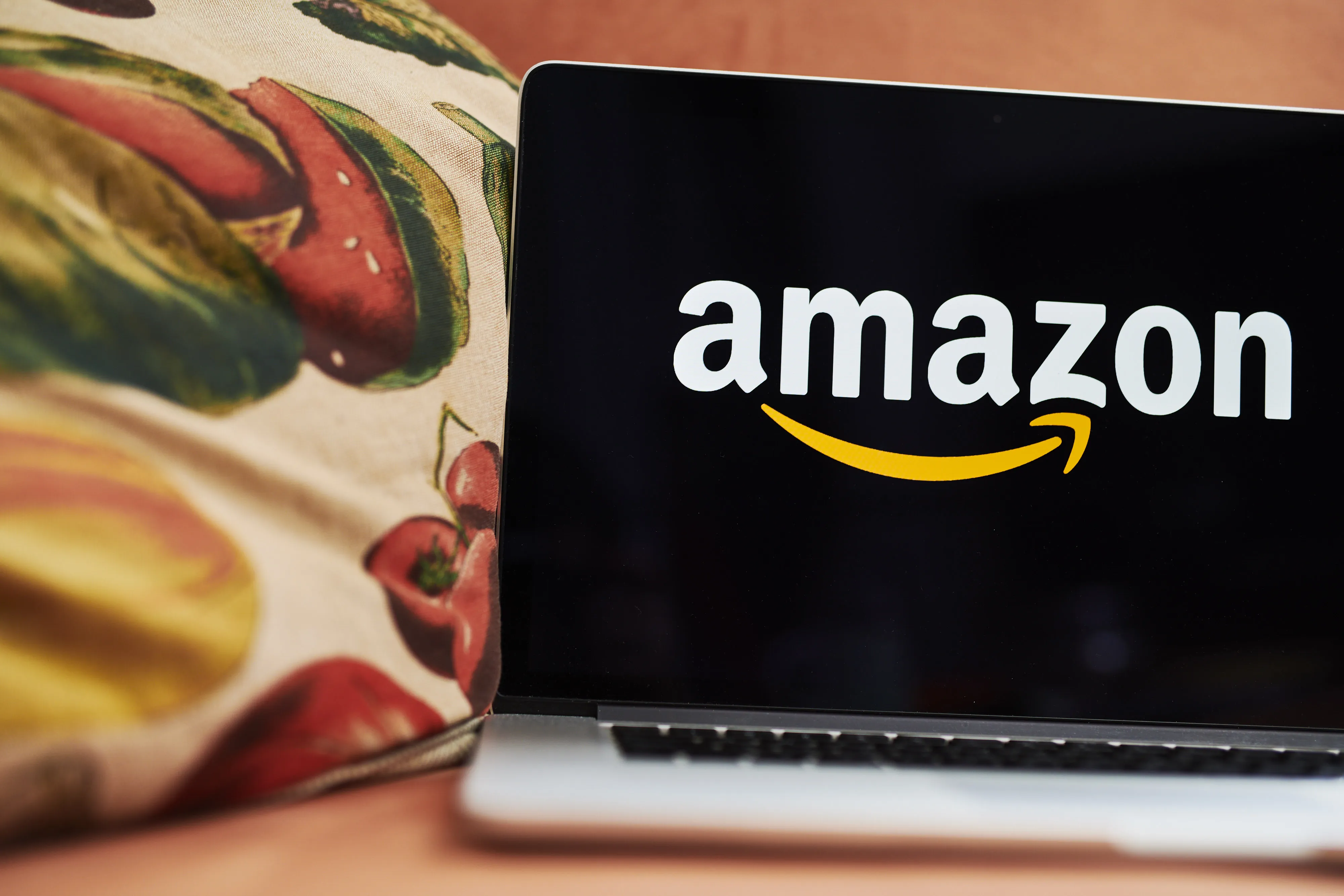 The logo for Amazon.com Inc. on a laptop computer.