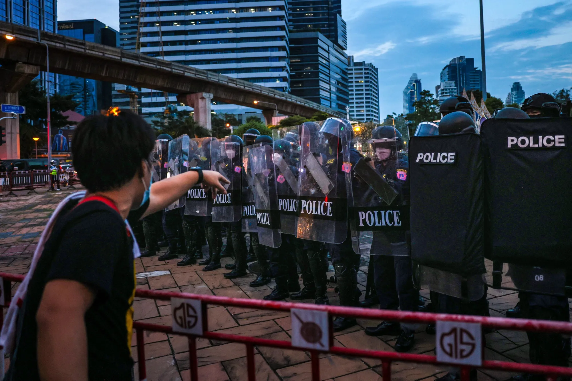 A protester gestures at riot police during a demonstration in Bangkok on Nov. 14.