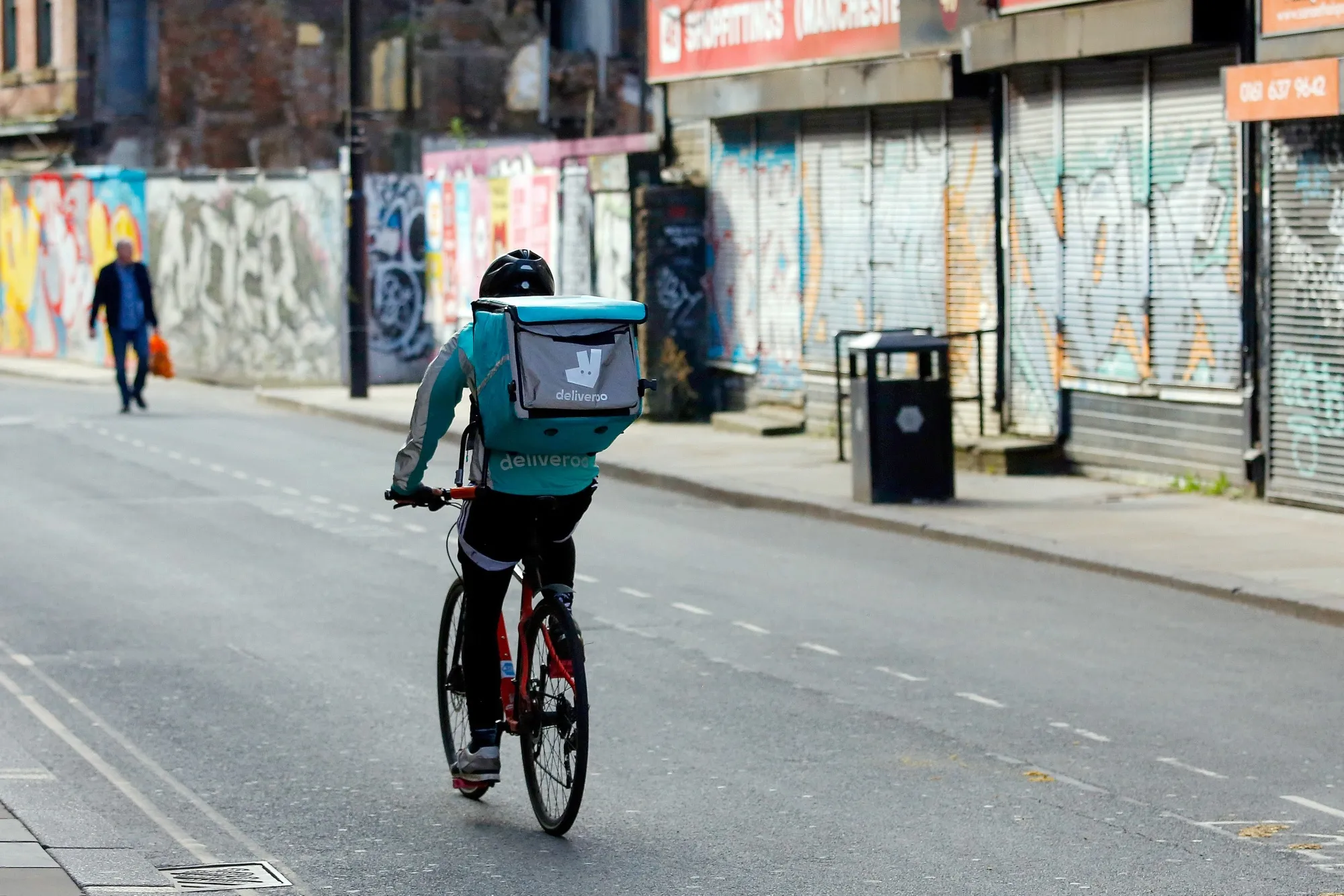 A food delivery courier for Deliveroo cycles in Manchester, U.K. on April 8.