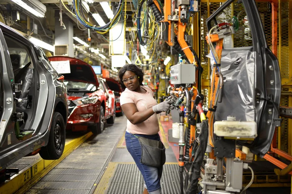 A line worker installs the back seats on the flex line at Nissan Motor Co's automobile manufacturing plant in Smyrna, Tennessee, August, 2018.