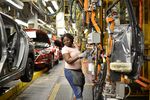 A line worker installs the back seats on the flex line at Nissan Motor Co's automobile manufacturing plant in Smyrna, Tennessee, August, 2018.