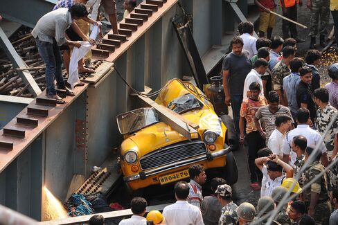 A taxi cab crushed by the collapsed bridge on March 31. 2016 in Kolkata, India.
