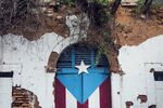 A Puerto Rican flag is seen painted on the doorway of an abandoned building in San Juan in 2016.
