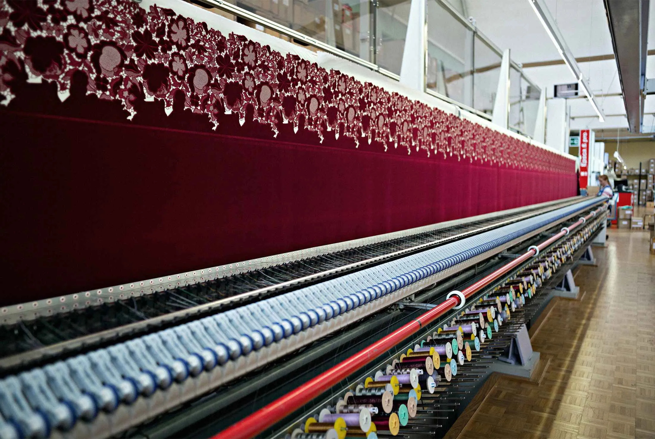 Textile is embroidered by an embroidery machine, manufactured by Saurer AG, in the stitching hall