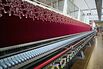 Textile is embroidered by an embroidery machine, manufactured by Saurer AG, in the stitching hall