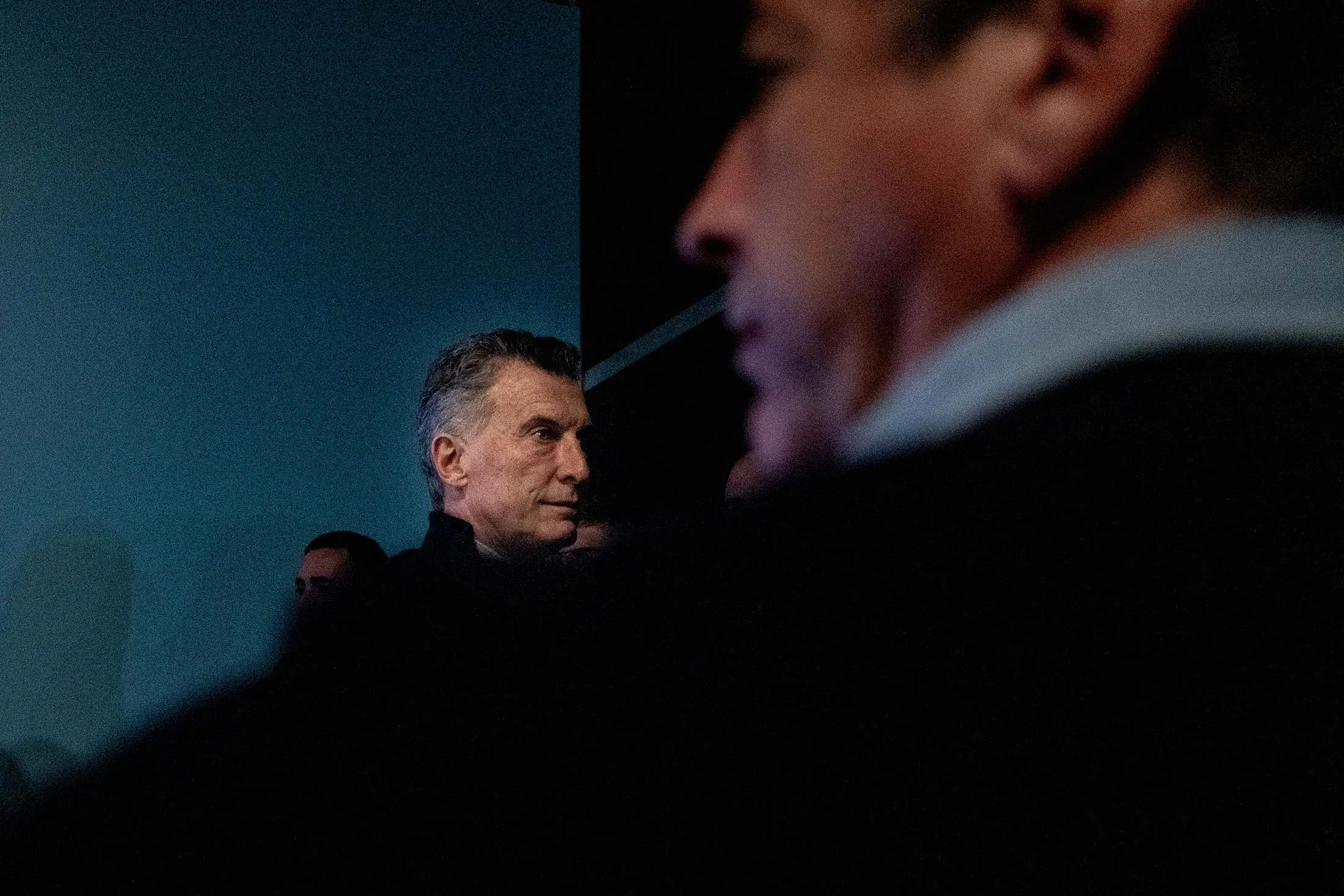Argentine President Mauricio Macri, center, leaves a news conference at his party’s headquarters during a primary election night rally in Buenos Aires on Aug. 11.