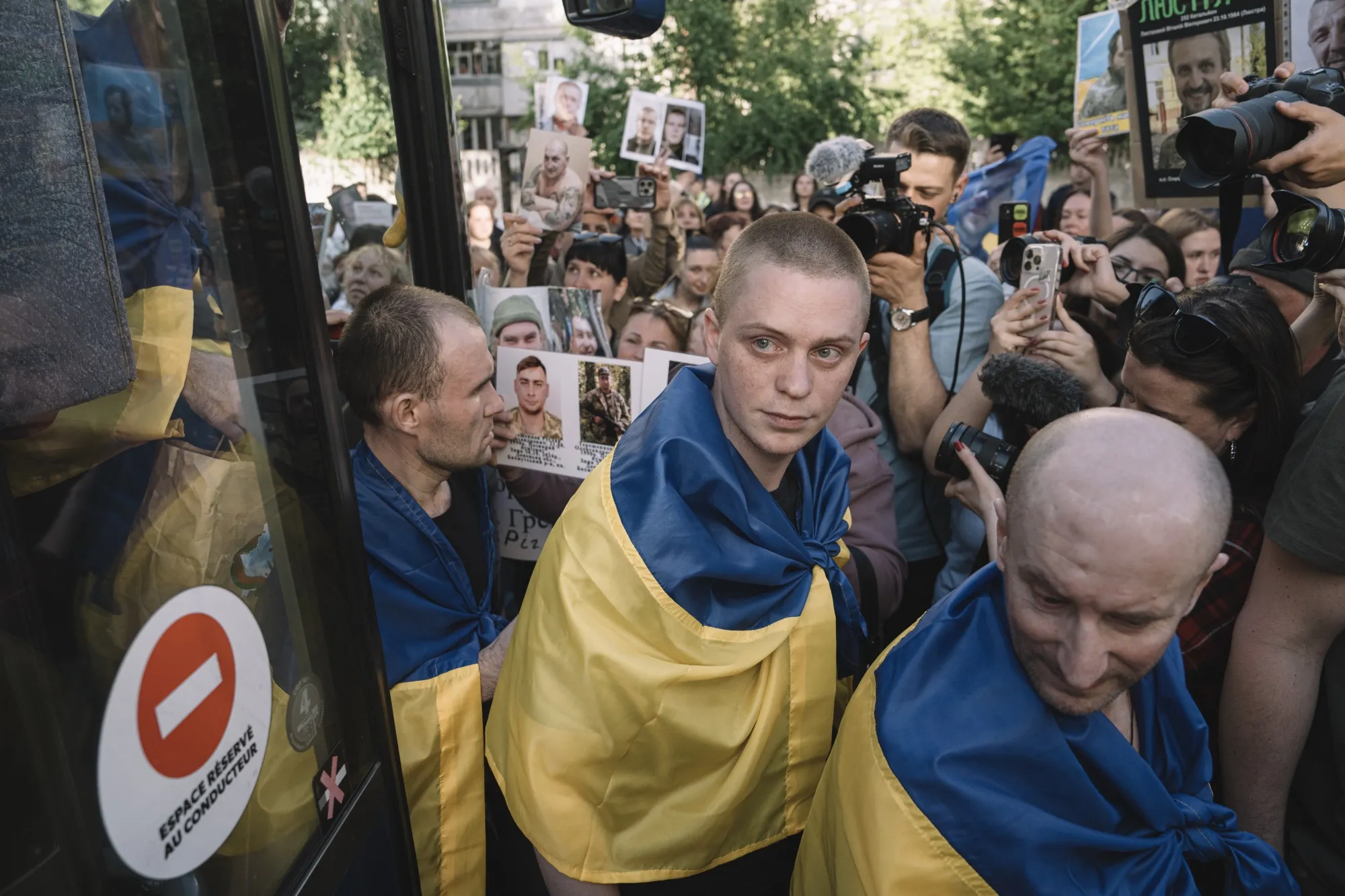 Relatives and military personnel welcome Ukrainian servicemen following a major prisoner-of-war&nbsp;swap with Russia at an undisclosed location in Ukraine, on Friday.