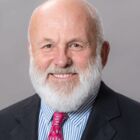 Headshot of John H Tyson