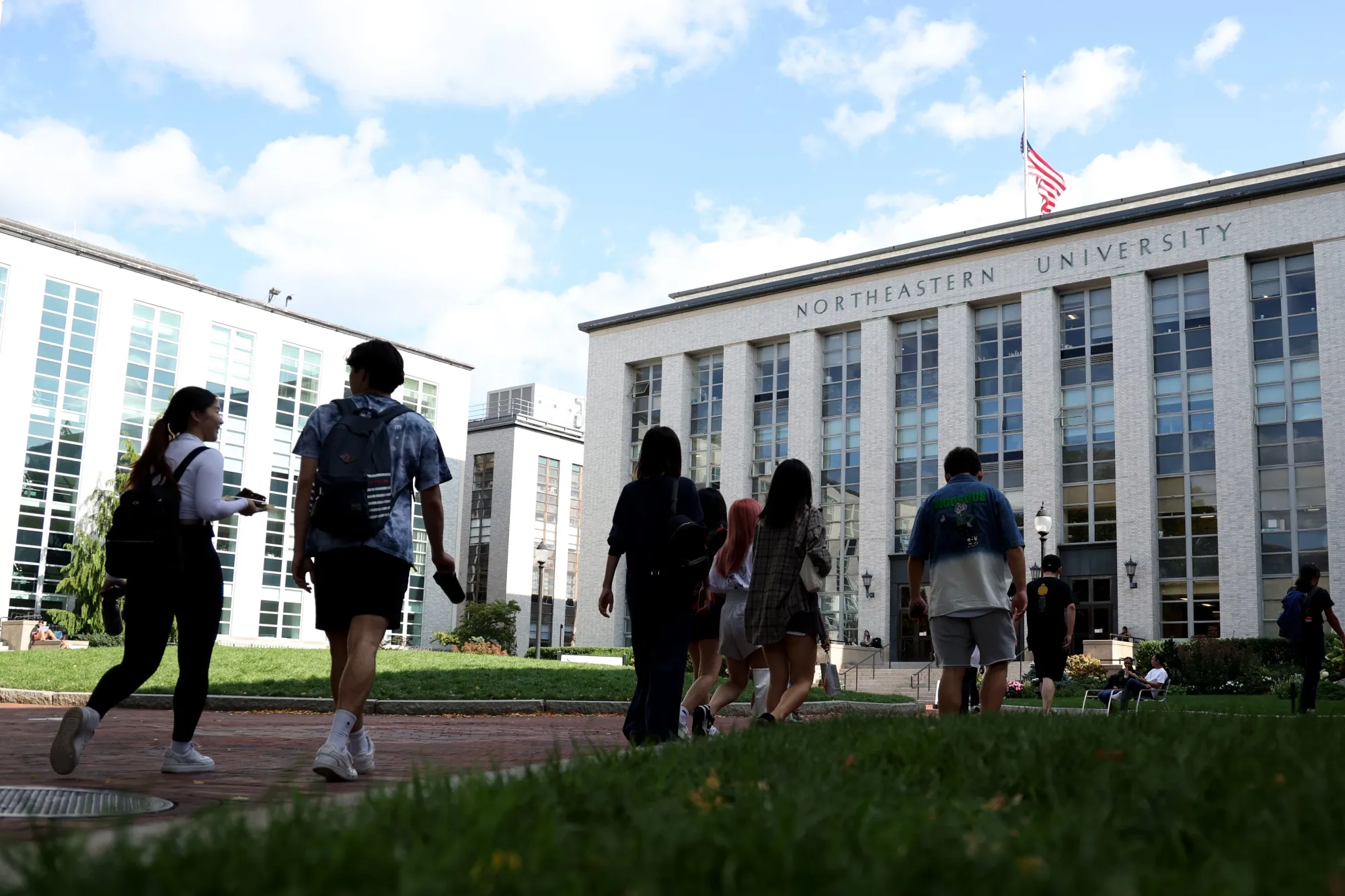 Students walk on the Northeastern University campus&nbsp;in Boston.