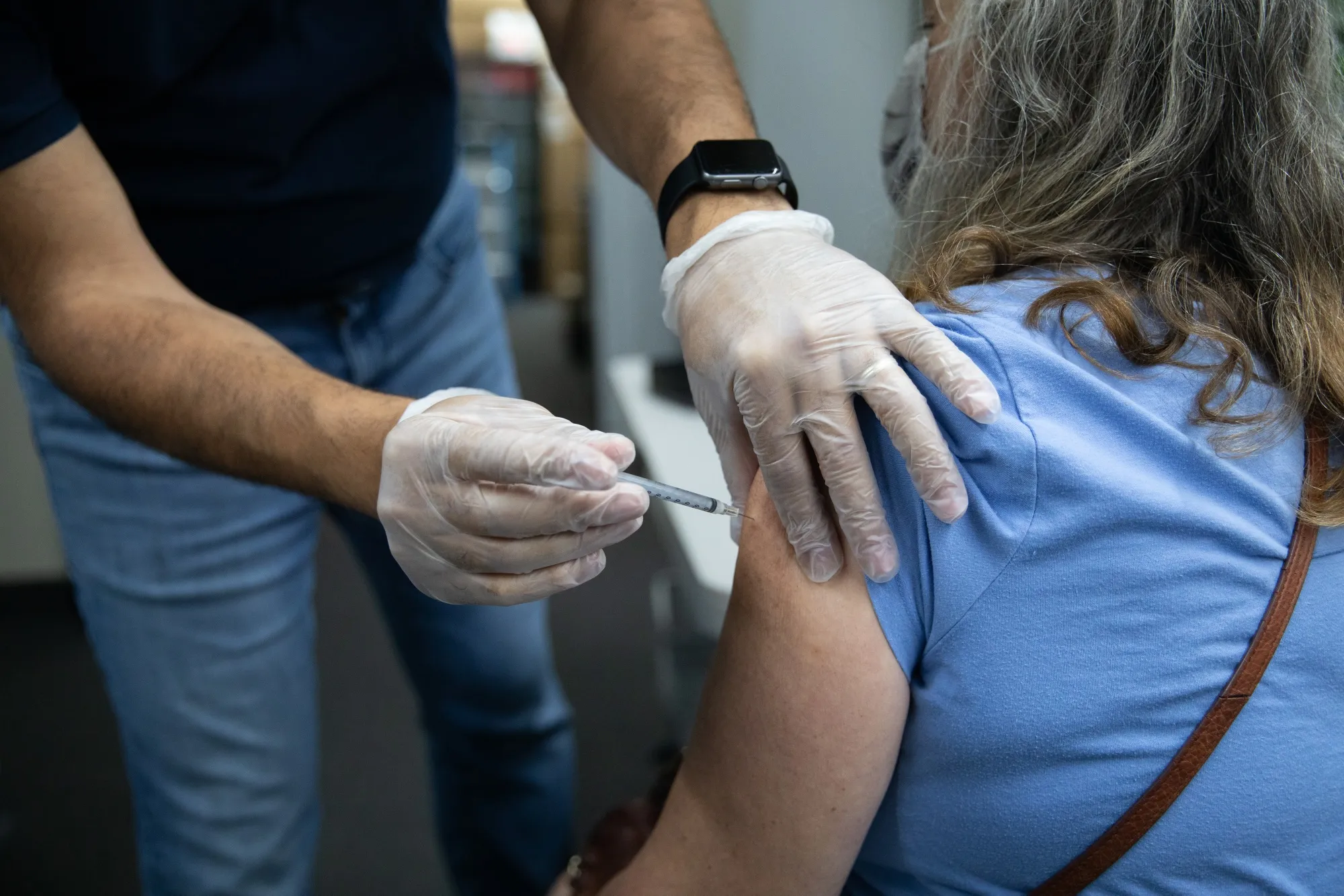 A Pharmacy Administers Third Doses Of Covid-19 Vaccines 