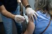 A Pharmacy Administers Third Doses Of Covid-19 Vaccines 