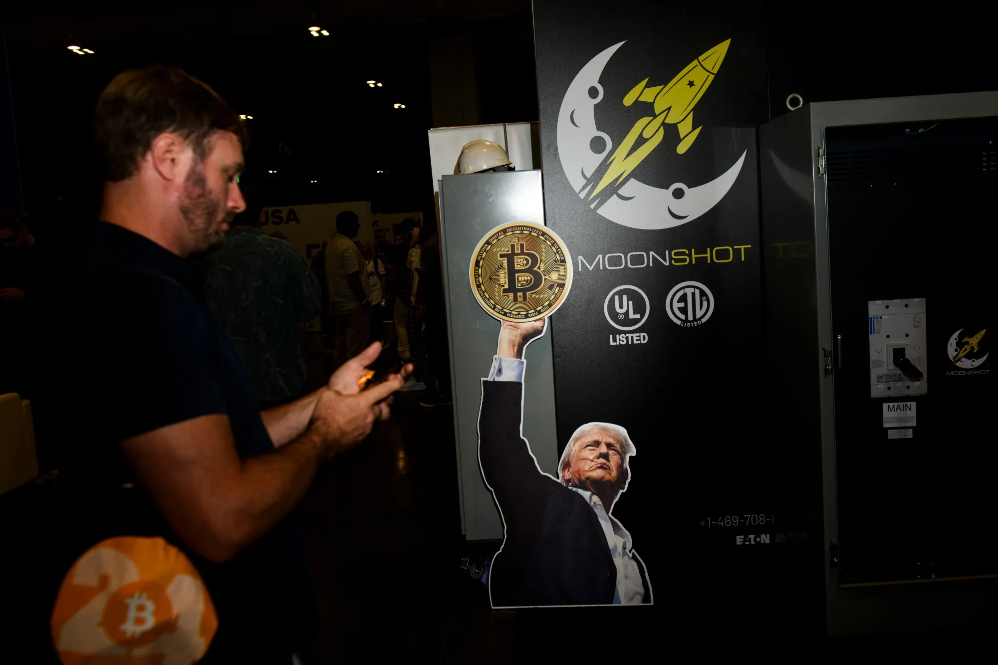A sign featuring former US President Donald Trump on a Moonshot booth during the Bitcoin 2024 conference in Nashville in July.