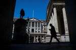 A pedestrian passes the Bank of England&nbsp;in the City of London.