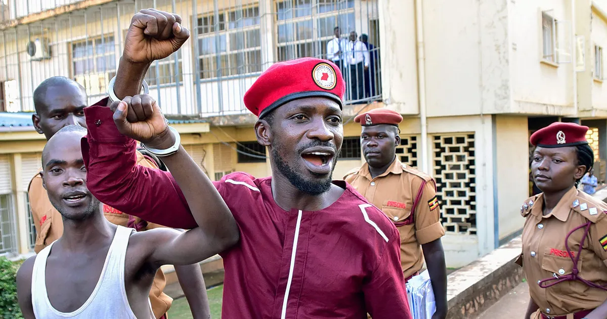 Bobi Wine is led&nbsp;to Luzira prison in Kampala in April.