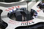Employees work at the Tokyo Stock Exchange.