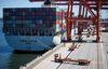 A China Ocean Shipping Group Co. (COSCO) cargo ship is unloaded at the Port of Vancouver terminal in Vancouver, British Columbia, Canada.