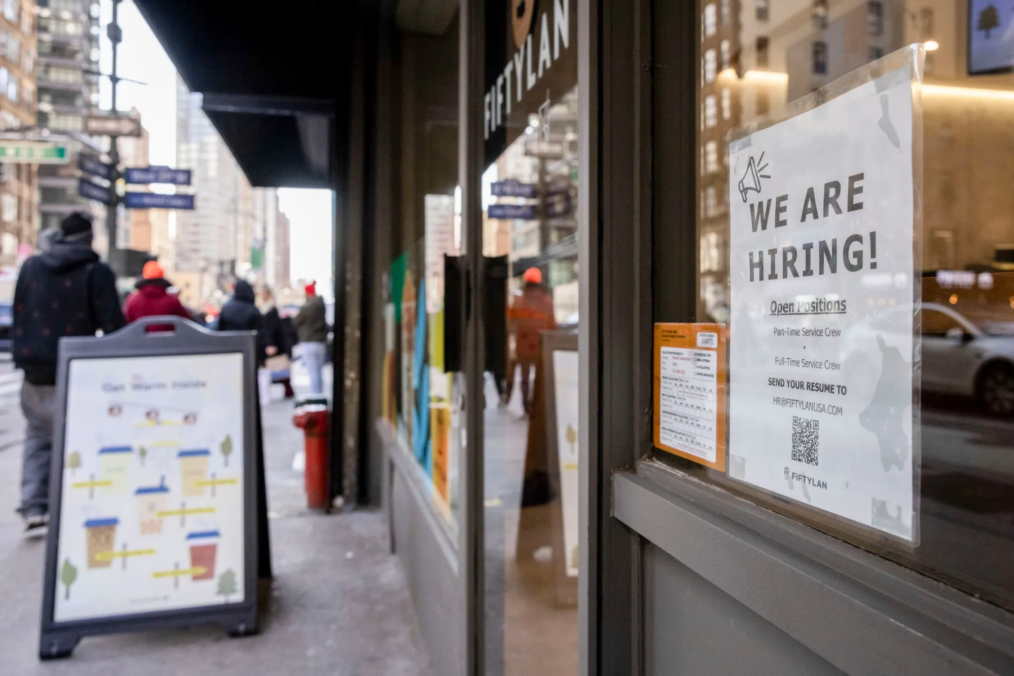 A hiring sign displayed at a store in the Chelsea neighborhood of New York.
