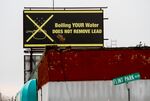A billboard warns residents about lead in water in Flint, Michigan in 2016.