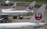 Japan Airlines Corp. (JAL) aircraft sit parked at Haneda Airport in Tokyo, Japan, on Thursday, July 28, 2016. JAL is scheduled to release full-year earnings July 29.