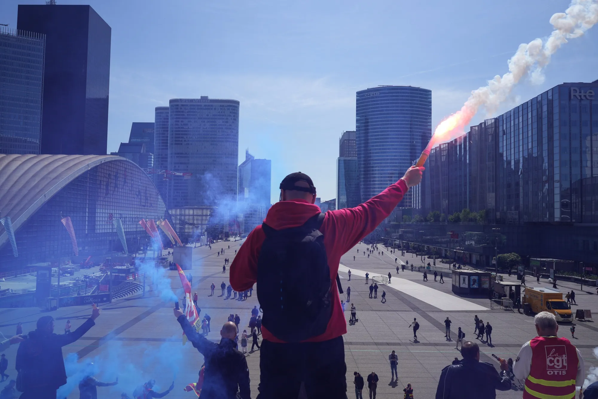 A pension reform protestor with a flare in the financial district of Paris, France, on May 3.
