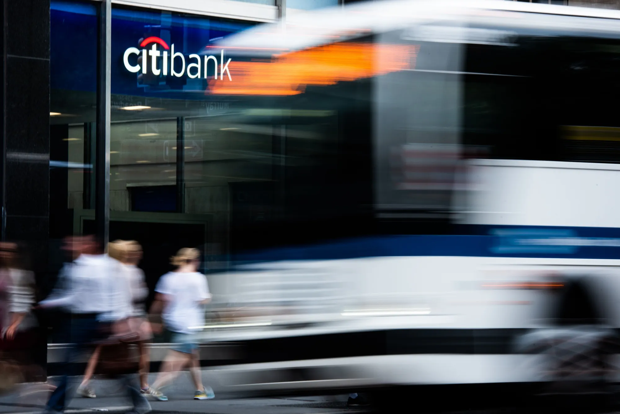 Pedestrians pass a Citigroup Inc. bank branch in New York, U.S.