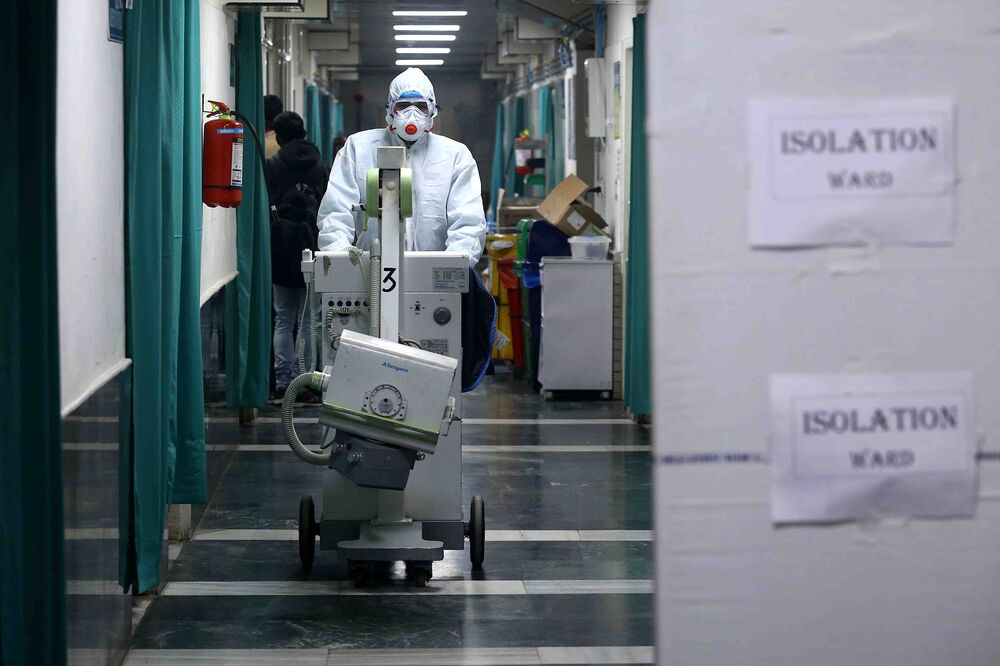 A medical staff member wearing protective clothing to help stop the spread of a deadly virus which began in Wuhan/