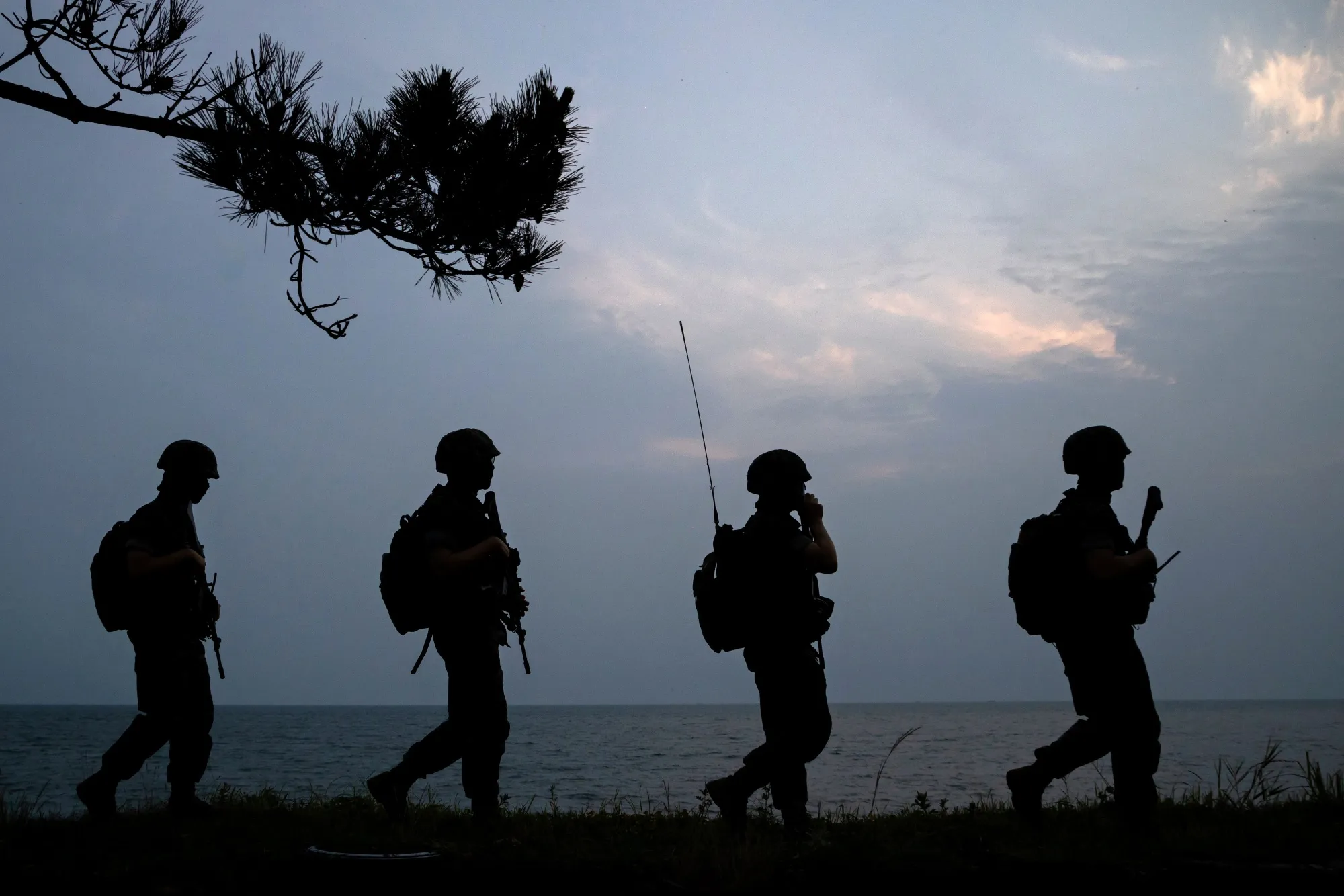 South Korean Marines&nbsp;patrol Guridong beach at dusk on Yeonpyeong Island&nbsp;on June 26.