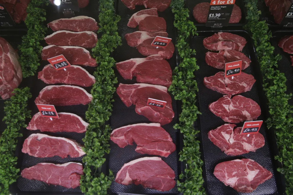 Hand written price signs sit on labels on cuts on beef steaks displayed for sale in a butcher's counter inside a Sainsbury's supermarket store, operated by J Sainsbury Plc, in the Wandsworth district of London, U.K., on Wednesday, April 15, 2015. Revenue at J Sainsbury rose 0.2 percent, returning to growth for the first time since August, Kantar Worldpanel said in a statement.