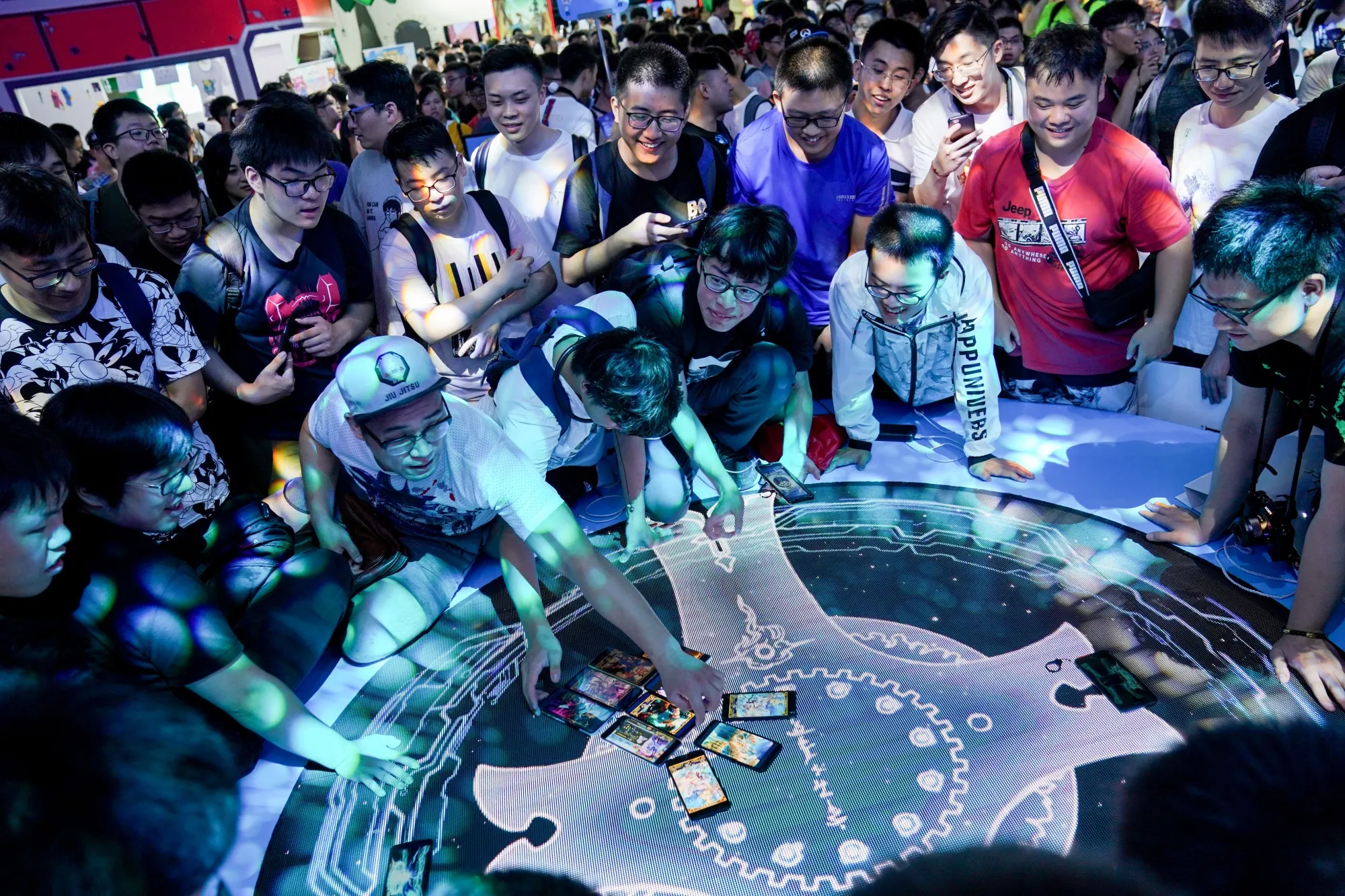People play the role-playing mobile game ‘Fate/Grand Order’ in Shanghai, Aug. 2019.