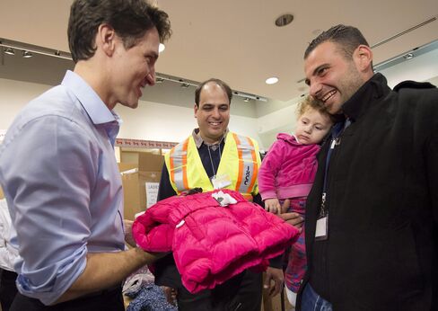 Trudeau greets refugees from Syria