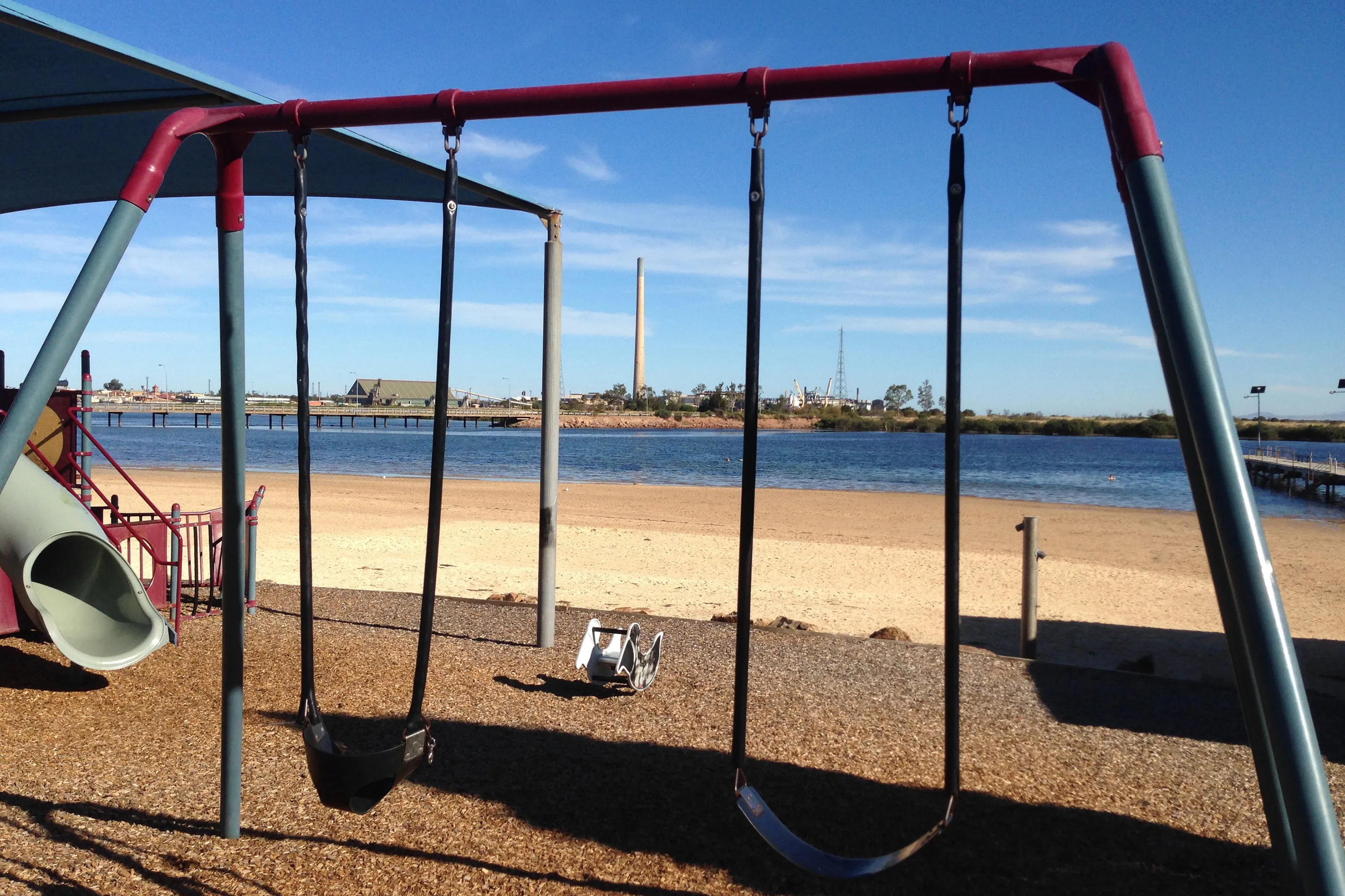 The Nyrstar NV's Port Pirie lead smelter is seen from a playground.
