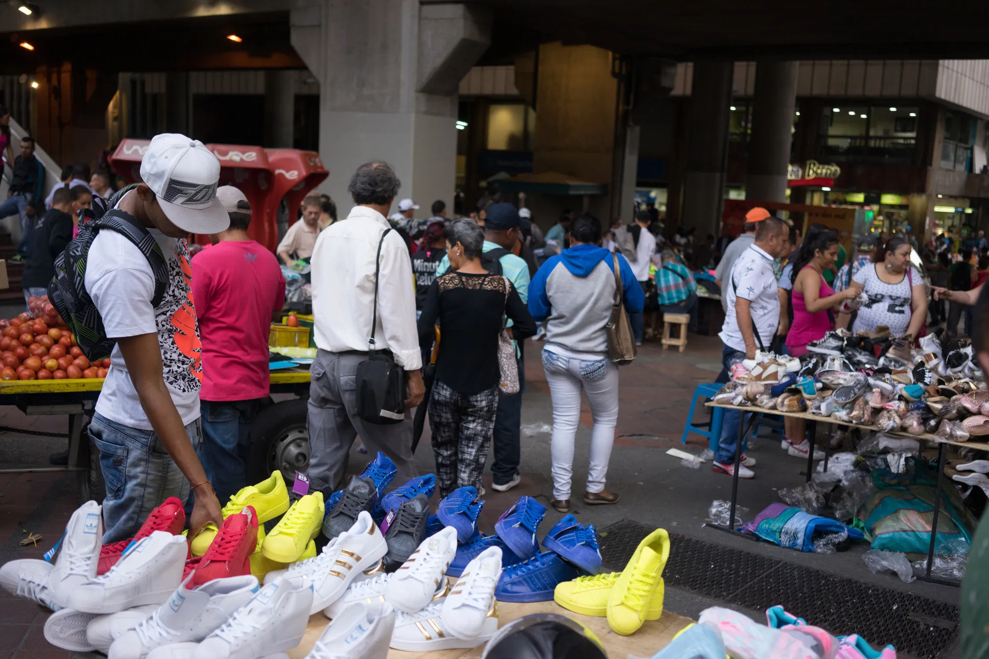 Shoes are displayed for sale at an outdoor market in Medellin, Colombia.